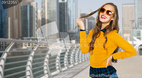 Image of happy young woman or teen girl in casual clothes