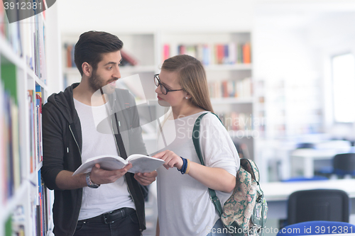 Image of students couple  in school  library