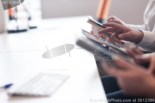 Image of business people on meeting  using tablet