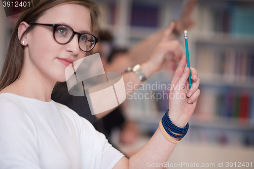 Image of group of students  raise hands up