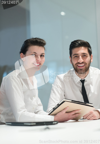 Image of portrait of young  business couple at office