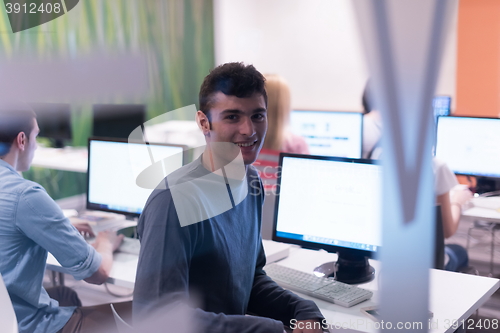 Image of technology students group working  in computer lab school  class