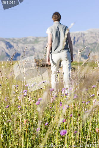 Image of Woman in a mountain meadow