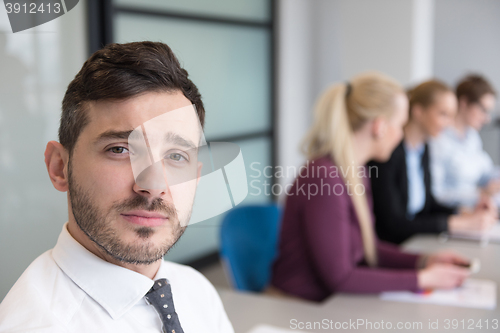 Image of young business people group on team meeting at modern office