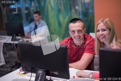 Image of technology students group in computer lab school  classroom