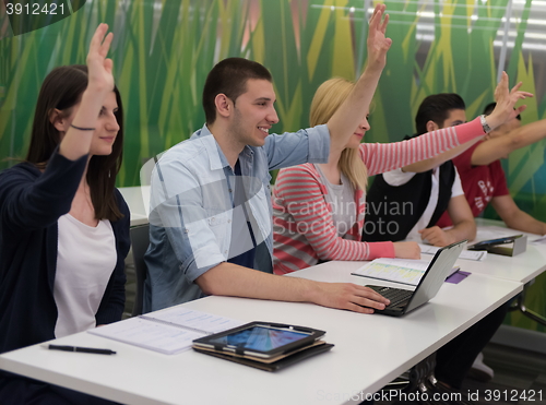 Image of students group raise hands up