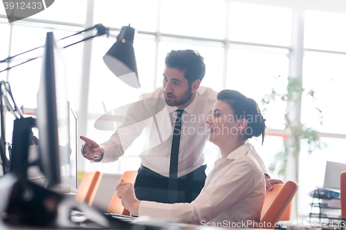 Image of business couple working together on project