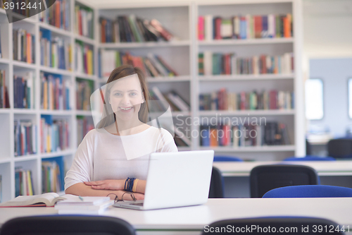 Image of female student study in school library