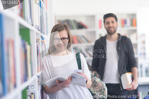 Image of students couple  in school  library