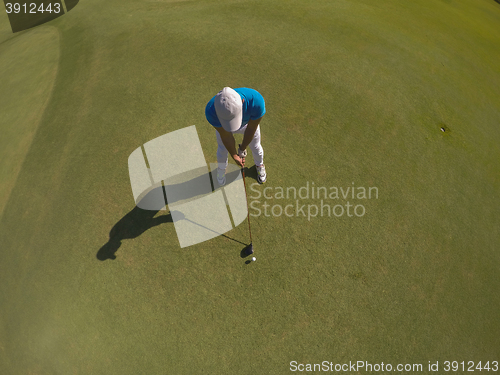 Image of top view of golf player hitting shot