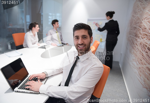 Image of young business man at meeting