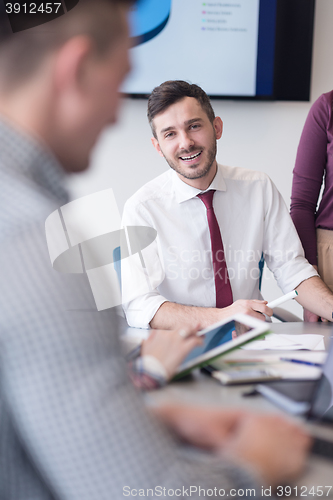 Image of young business people group on meeting at modern office