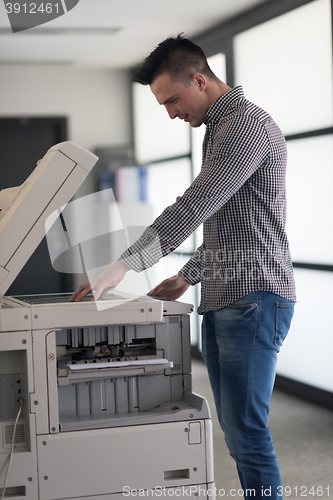 Image of young  business man copy documents
