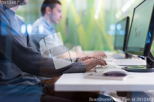 Image of technology students group working  in computer lab school  class