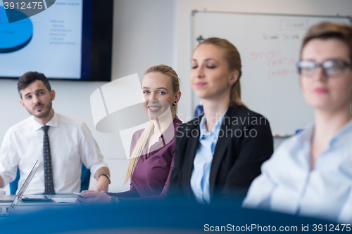 Image of young business people group on team meeting at modern office