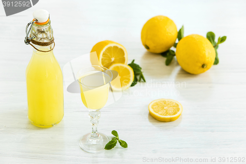 Image of Italian traditional liqueur limoncello with lemon