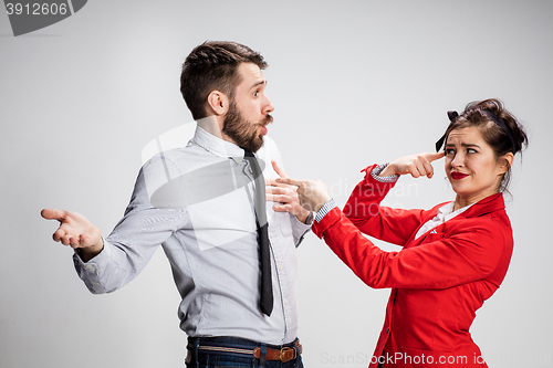 Image of The business man and woman communicating on a gray background