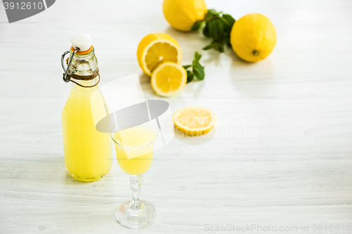 Image of Italian traditional liqueur limoncello with lemon