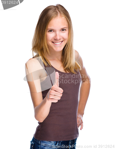 Image of Woman is showing thumb up gesture