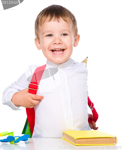 Image of Little child playing school