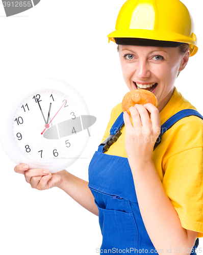 Image of Young construction worker is going to lunch