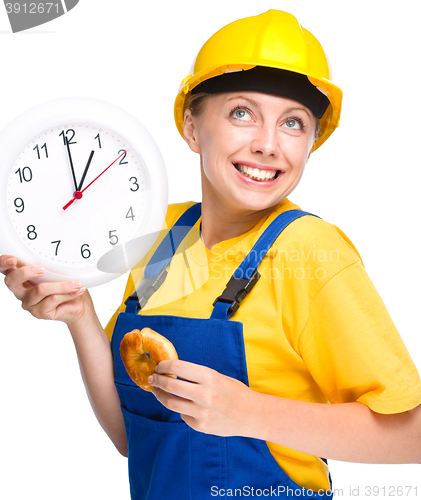 Image of Young construction worker is going to lunch