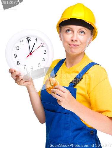 Image of Young construction worker is going to lunch