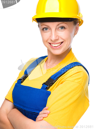 Image of Young happy lady as a construction worker