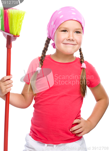 Image of Young girl is dressed as a cleaning maid