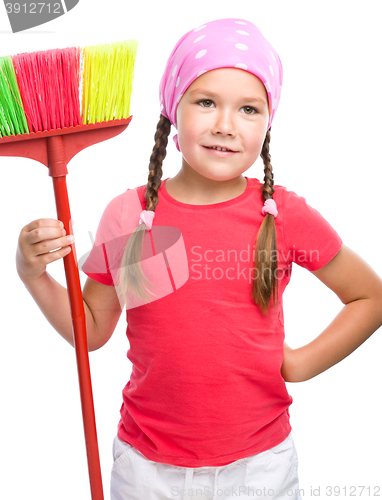 Image of Young girl is dressed as a cleaning maid