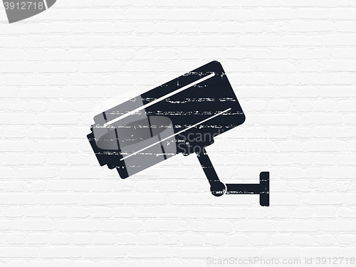Image of Security concept: Cctv Camera on wall background