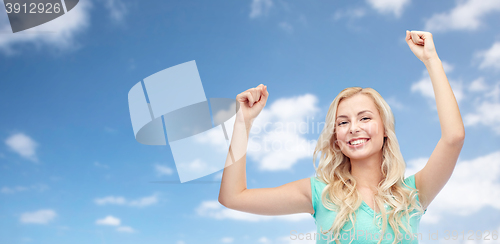 Image of happy young woman or teen girl celebrating victory