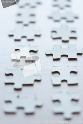 Image of close up of puzzle pieces on table