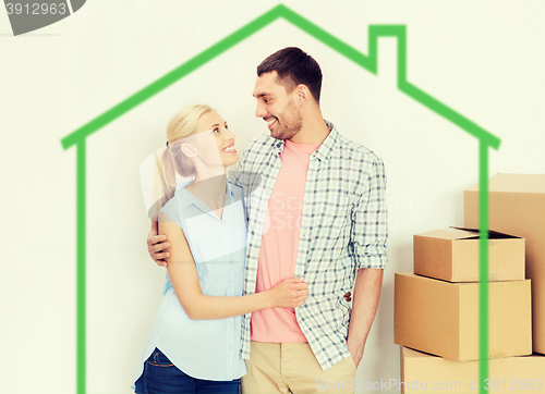 Image of couple with cardboard boxes moving to new home
