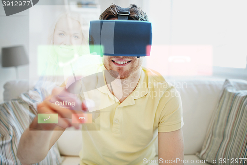 Image of young man in virtual reality headset or 3d glasses