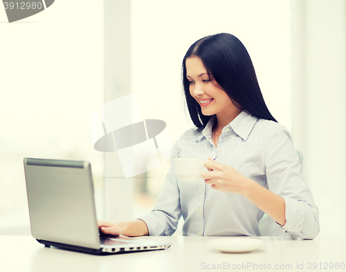 Image of smiling businesswoman or student with laptop