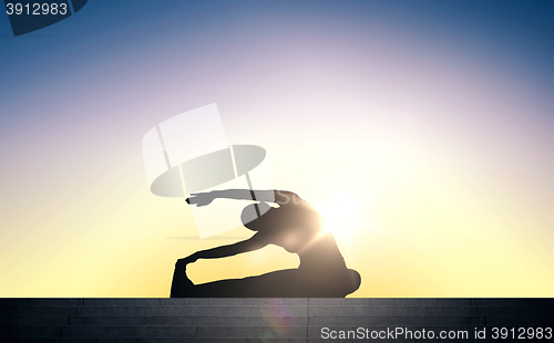 Image of woman doing exercises on stairs over sun light