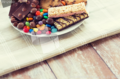 Image of close up of candies, chocolate, muesli and cookies