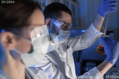 Image of close up of scientists making test in lab