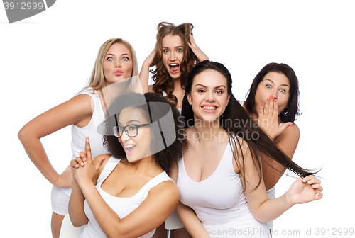 Image of group of happy women in white underwear having fun