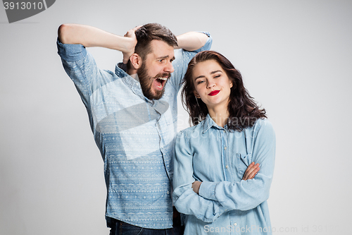 Image of The young couple with different emotions during conflict