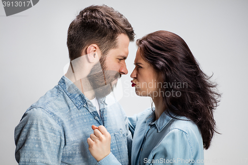 Image of The young couple with different emotions during conflict