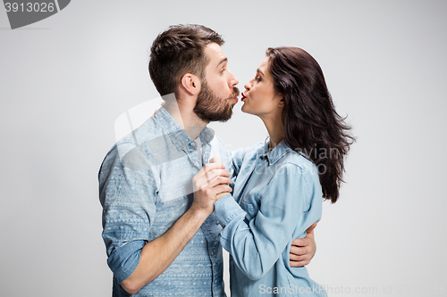 Image of Portrait of happy couple on gray background