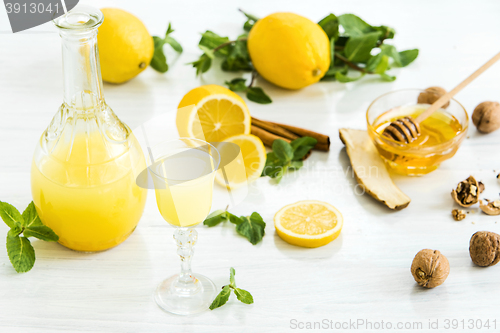 Image of Italian traditional liqueur limoncello with lemon