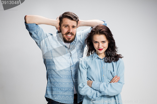 Image of The young couple with different emotions during conflict