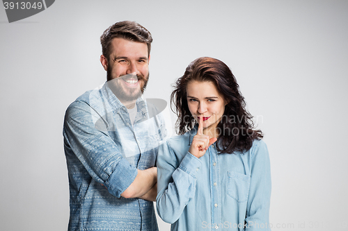 Image of Portrait of happy couple on gray background