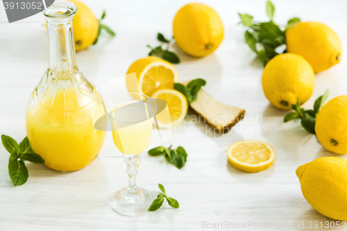 Image of Italian traditional liqueur limoncello with lemon