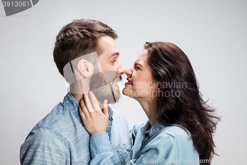 Image of Portrait of happy couple on gray background
