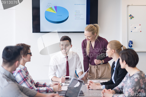 Image of young business people group on meeting at modern office