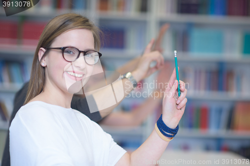 Image of group of students  raise hands up